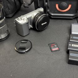 Sony Nex-5n mirrorless camera with 2 lenses and 2 carrying cases