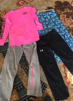 2 under armour pants girls 14 . Justice shirt 16 . Two justice girls size 14 pants