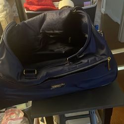 2 piece Navy duffle suitcase with wheels and gold trim 24’ w/ matching  carrier