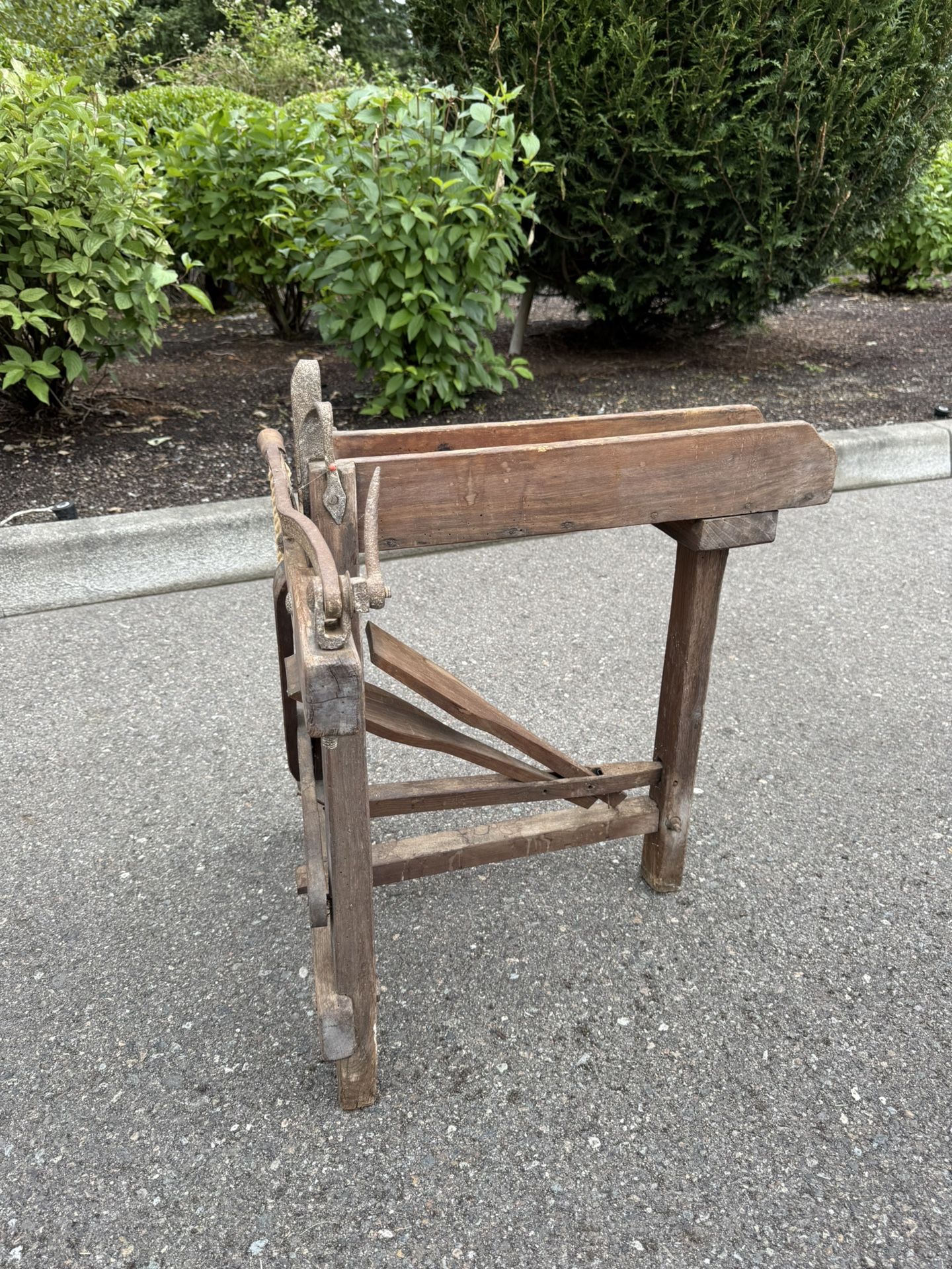Antique wooden press or woodworking machine.