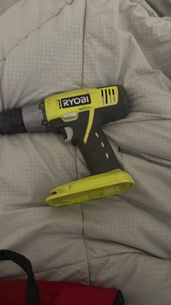 Drill with battery and bunch of flatheads screwdrivers hammers, wrenches