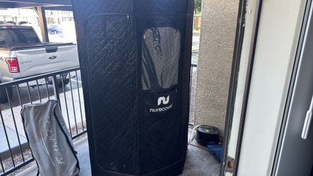Sauna has a cold plunge inflatable with it