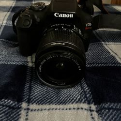 Canon Rebel T7 Comes With Charger And Extra Lens