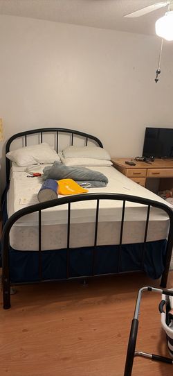 full size black metal bed with mattress