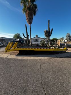 Yellow Flatbed Equipment Trailer