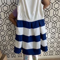 Woman’s Blue And White Dress