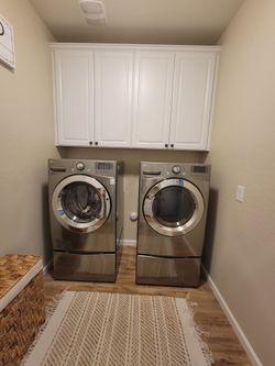 LG Front-Load Washer and Dryer Set with pedastals
