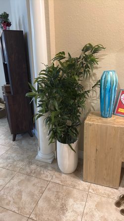 Beautiful faux plant in white pot