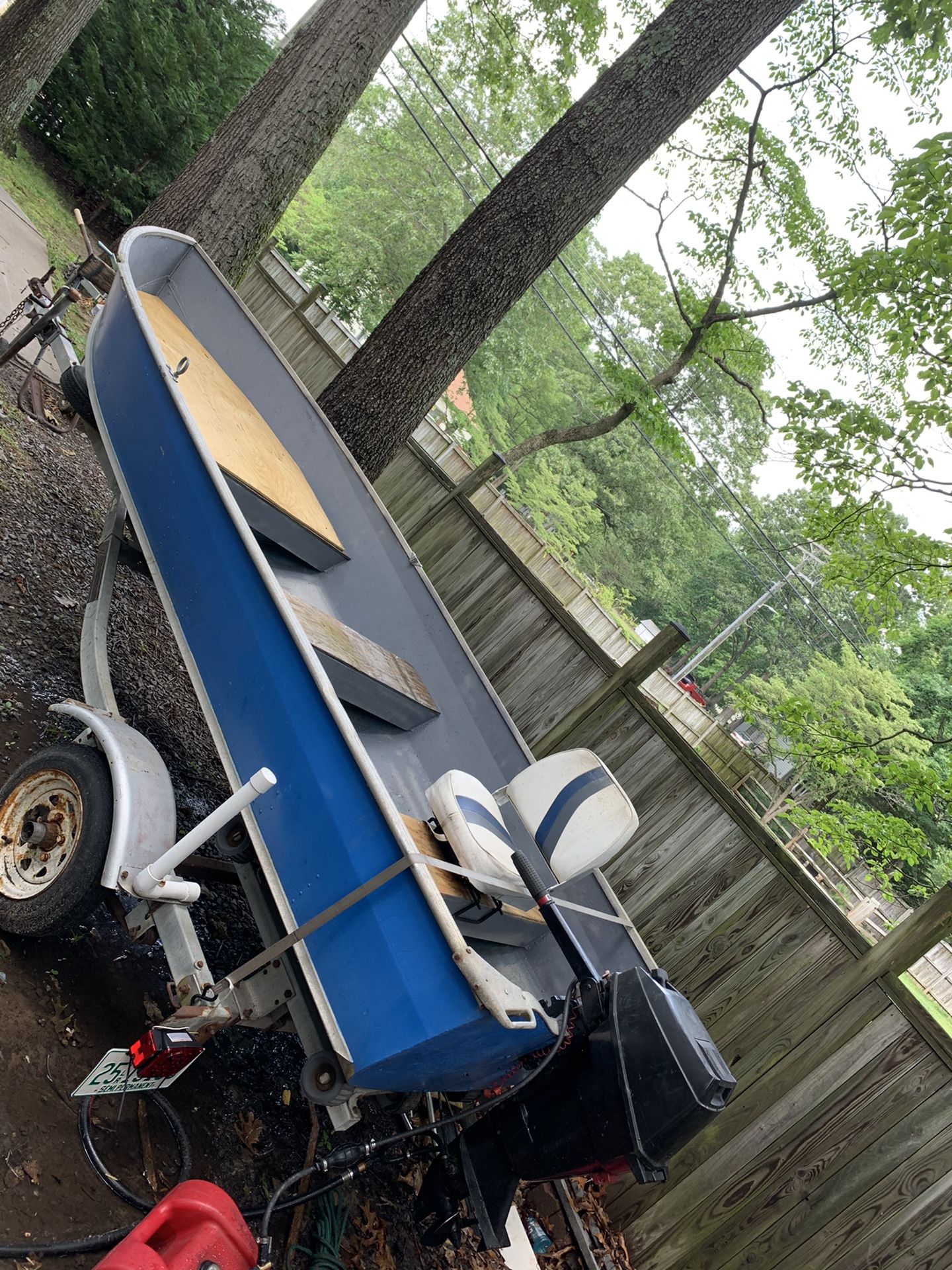 14' jon boat with LoadRite trailer and 15hp mercury motor