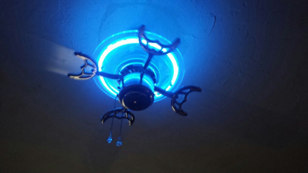 Neon blue light ceiling fan with clear blades