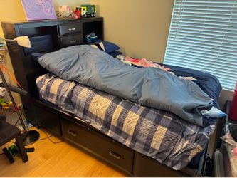 Ashley’s Queen storage bed frame and mattress.