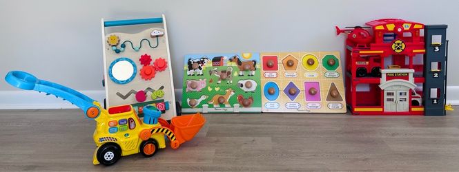 Baby walker, bulldozer toy with balls, animal and shape/color puzzle and fire station with helicopter, fire truck and ambulance.