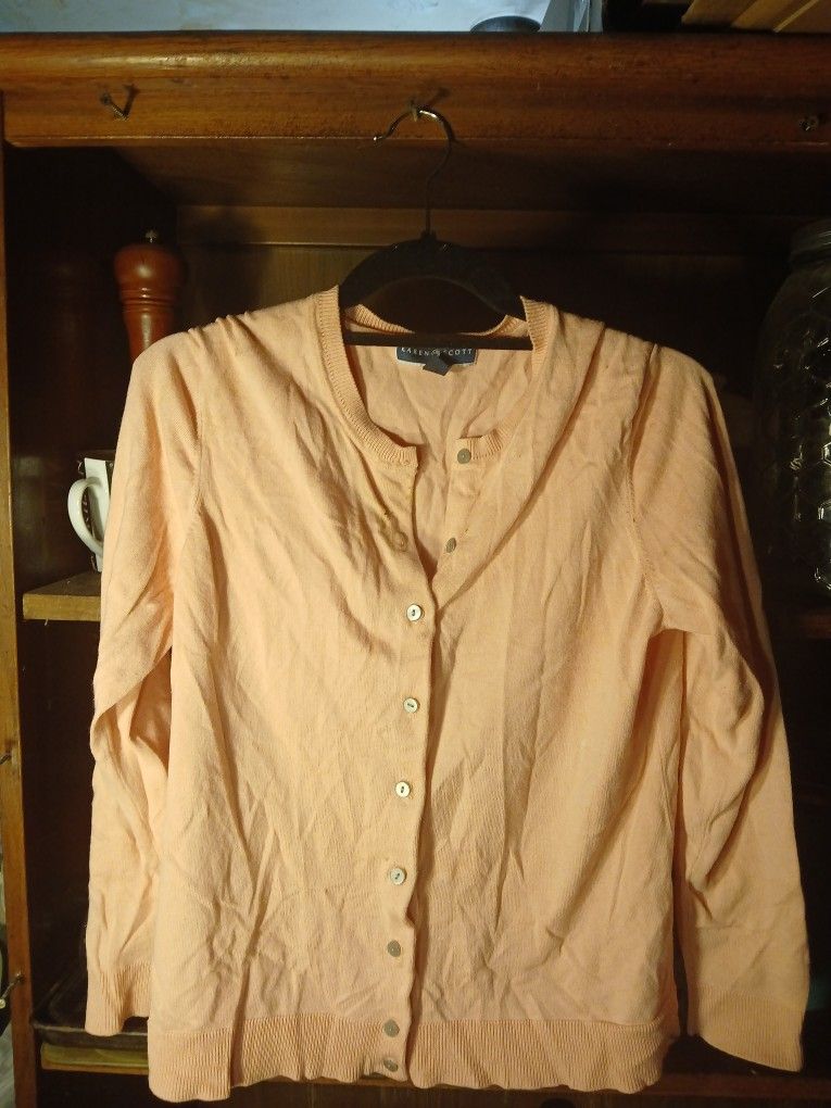 This is a Karen Scott peach v-neck cardigan.