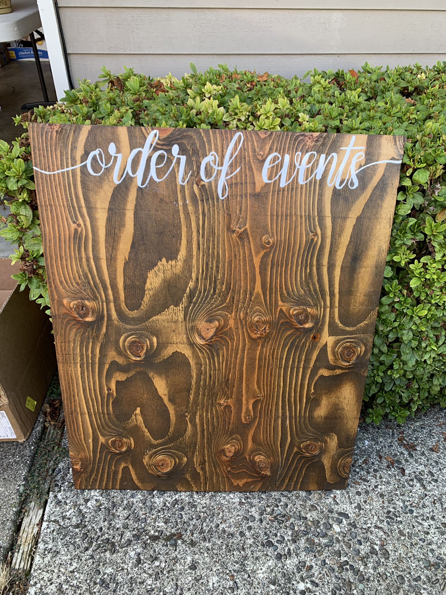 Order of events wood sign
