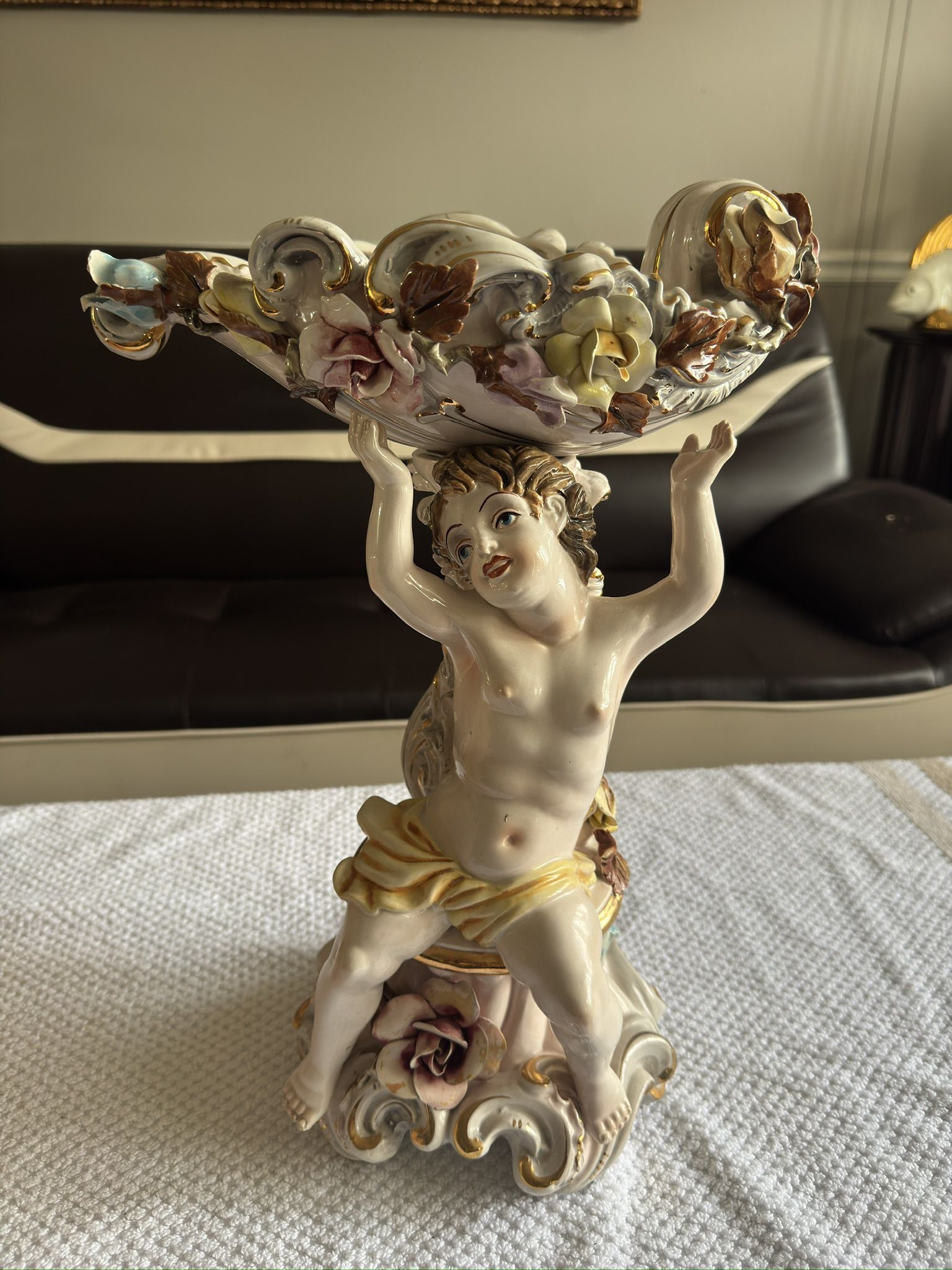 MEISSEN PORCELAIN CENTERPIECE, With one Putti Supporting A Flower Encrusted Basket; Height: 17”1/2