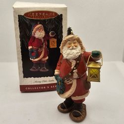 Hallmark Merry Olde Santa Christmas Ornament 1994 tree light 5 Lantern Wreath  

Ornament is in excellent condition 
Box has some wear due to storage 