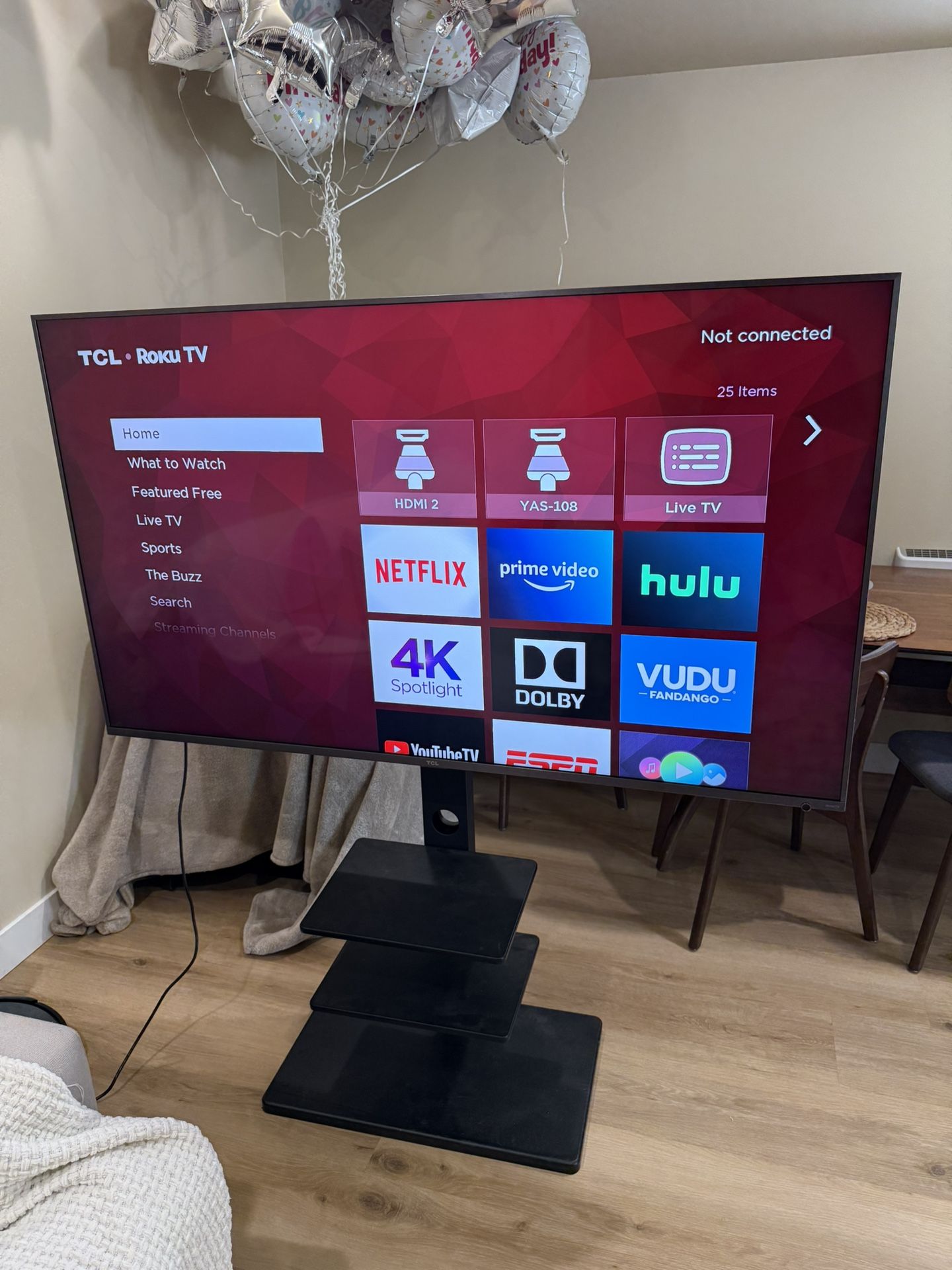 TV 65 inches TLC Roku Tv 4K , and TV stand