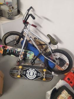 Scooter, bike and two skateboards