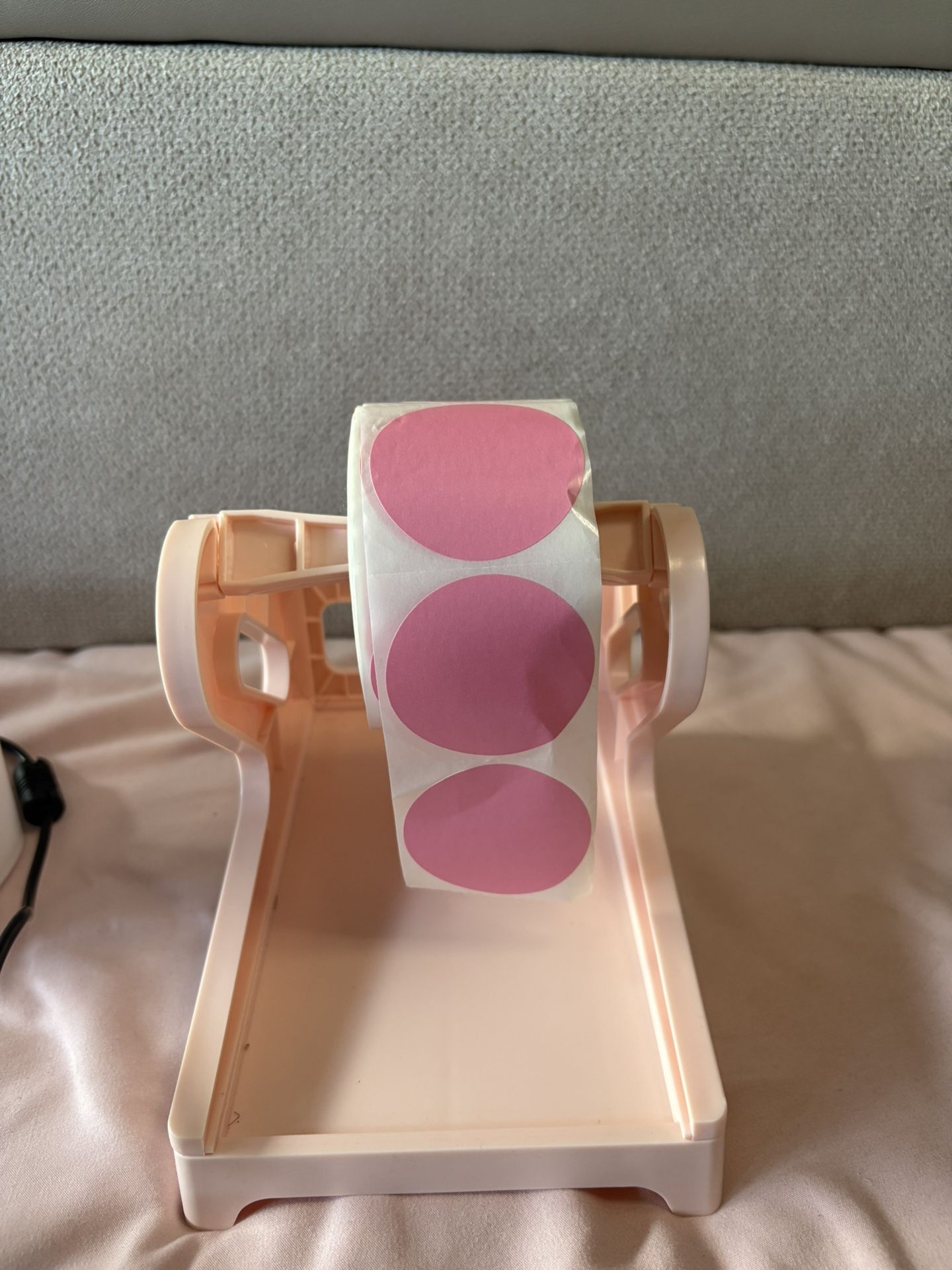 Roll of 2” pink circle thermal stickers + the pink holder