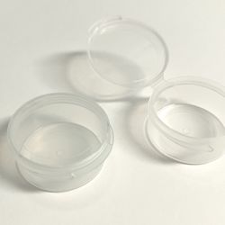 Small lidded plastic storage cups
