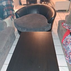 Round Sofa Spins With Black Table