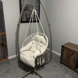 Hanging chair with base