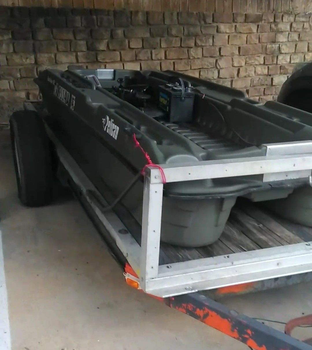 Pelican bass raider Mini Pontoon Boat comes with 2 seats and homemade trailer will trade or best offer!