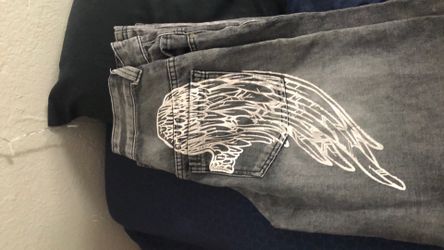 Gray Washed Jeans with Wing Graphic disclosure