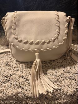 Crossbody hand bag by Carlos Santana