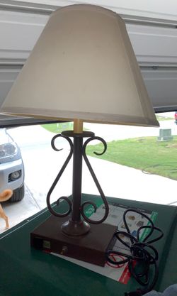 Lamp with outlet on base