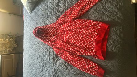 Red Supreme-style monogram hoodie.