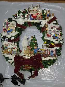Vintage Hawthorne village "Rudolphs Christmas Cove " light up wreath sculpture with damage and a " Night before Christmas " house with some color fadi