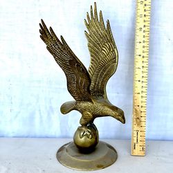 Antique great condition solid brass 12” tall eagle perched on a ball