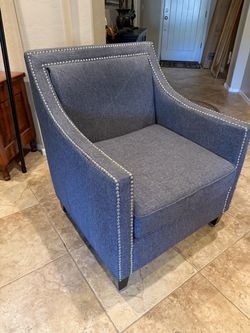 Gray studded arm chair