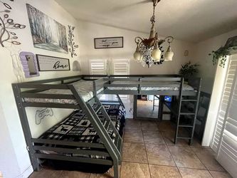 Near new wood framed corner triple bunk bed with desk