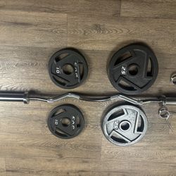 Beautiful BRAND NEW Curl Bar With Pair Of 25s And 10s 