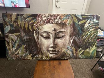 Buddha/Buddhist-inspired figure in tropical foliage