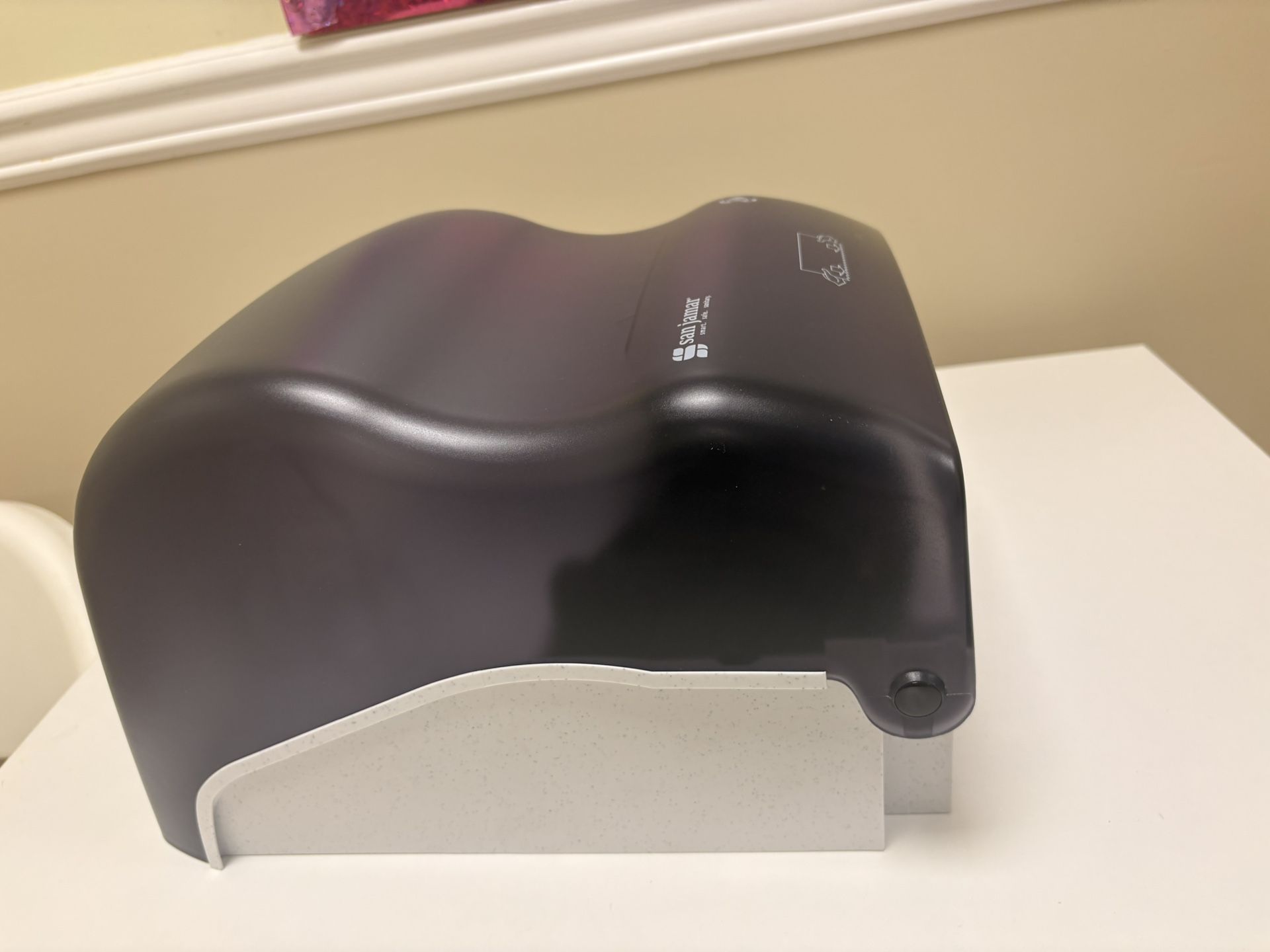 San Jamar paper towel dispenser