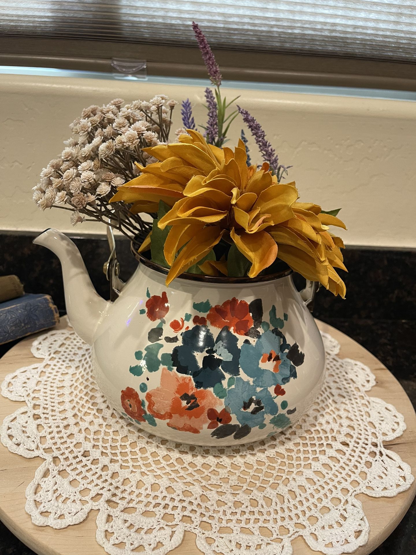 Vintage painted tea kettle with flowers
