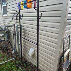 Metal Rack With 2 Racks To Hang Clothes On And 2 Hooks On Each Side With Wheels  