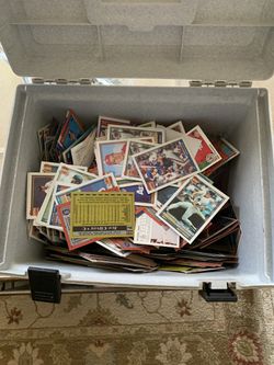 A box of baseball & football and basketball cards old