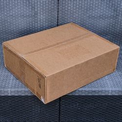 Clean medium size cardboard box with foam packing peanuts for shipping moving or storage