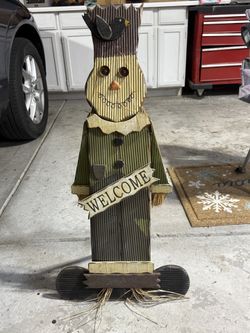 Wooden Scarecrow With Welcome Sign