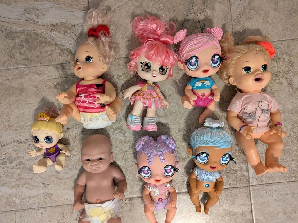 8-doll lot, including 1-Arlo Silicone Reborn Doll 2-Baby Alives 3- MGA'S Glitter BABYZ + 2 more