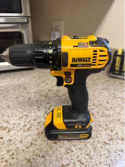 DeWalt DCD771 20V MAX drill/driver with a battery.