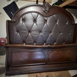 King Size Dark Wood Sleigh Bed with Tufted Leather Headboard