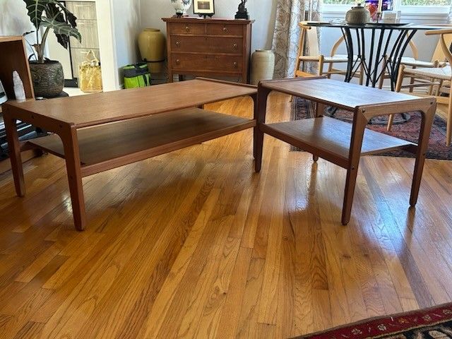 Mid-century modern solid teak double shelf coffee table and matching side table.
