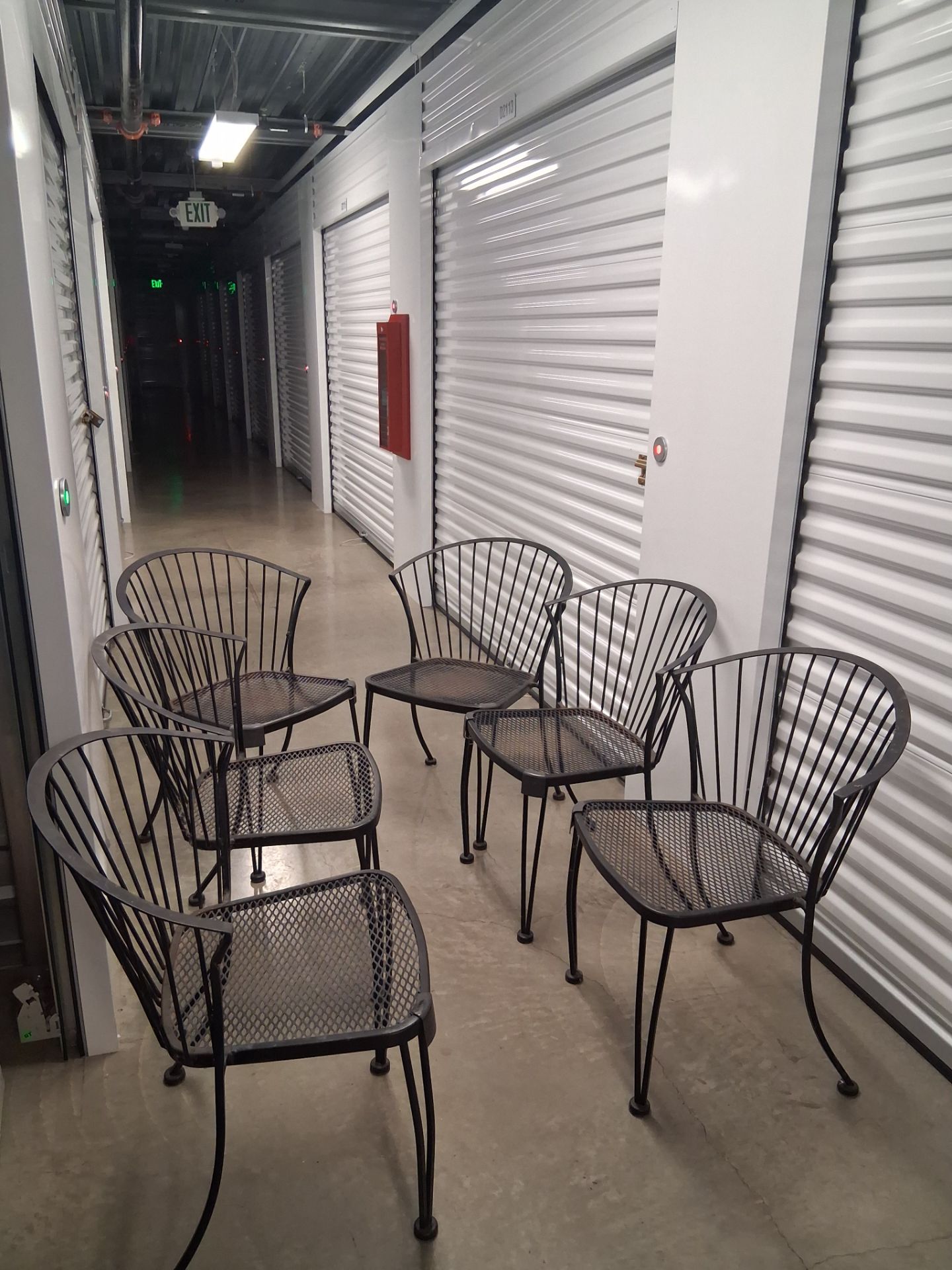 Matching set of 6 black metal mesh patio / dining chairs.