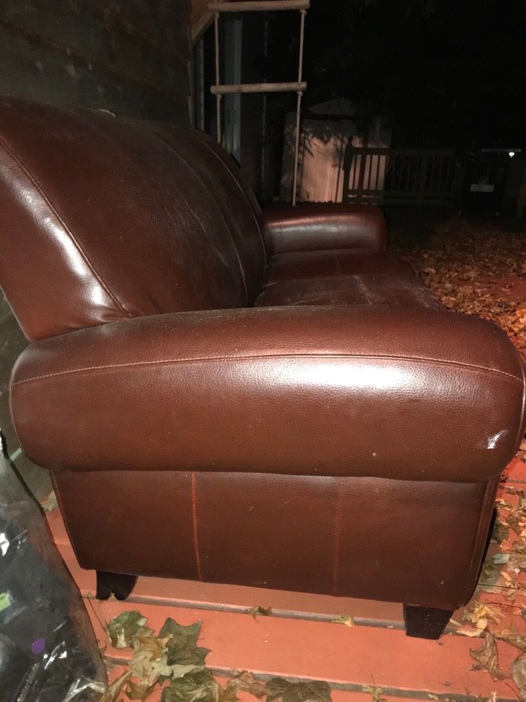 Brown leather sofa and love seat