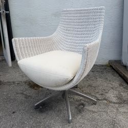 Vintage early-2000s swivel wicker lounge chair by Palecek Furniture located near the Miami Design District